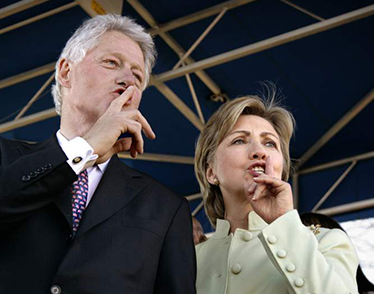 Clintons quieting crowd at an awards ceremony