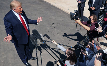 Trump, unlike Biden, takes questions from the press corps