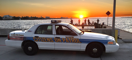 End of the day: COP Car at the 61st Street Park as the sun sets over Offits Bayou.