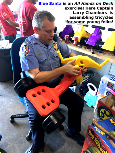 Captian Larry Chambers assembling tricycles.