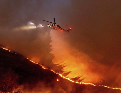 Helo drops fire retardent on Los Angeles fires