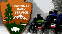 National Park Service Seal with Motorcycle Guests Entering a National Park