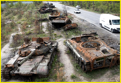 Russian Tanks alongside of the road after being destroyed by Ukrainian forces