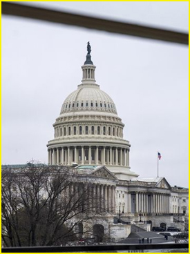 US-Capitol in background as seen through a window